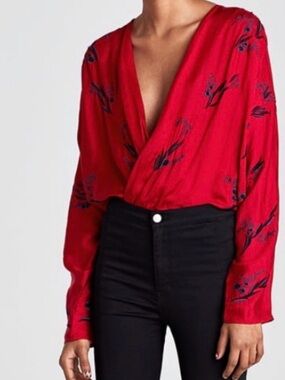 ZARA red bodysuit adorned with black beaded and embroidered details
